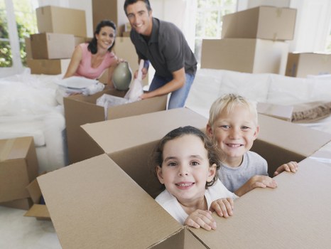 Loading furniture into a removals truck in Colindale