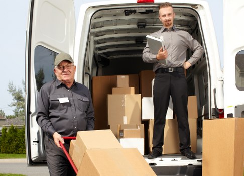 Removal team packing and loading furniture for a Colindale home move