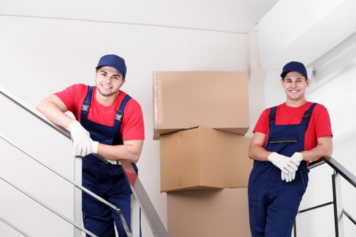 Moving team handling household furniture in a Colindale flat move
