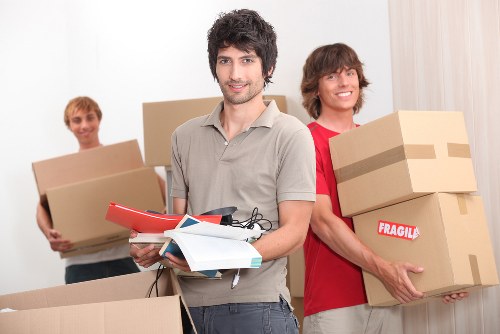 Professional moving team handling boxes and furniture for a Colindale relocation