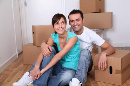Team lifting a sofa during a home move in Colindale